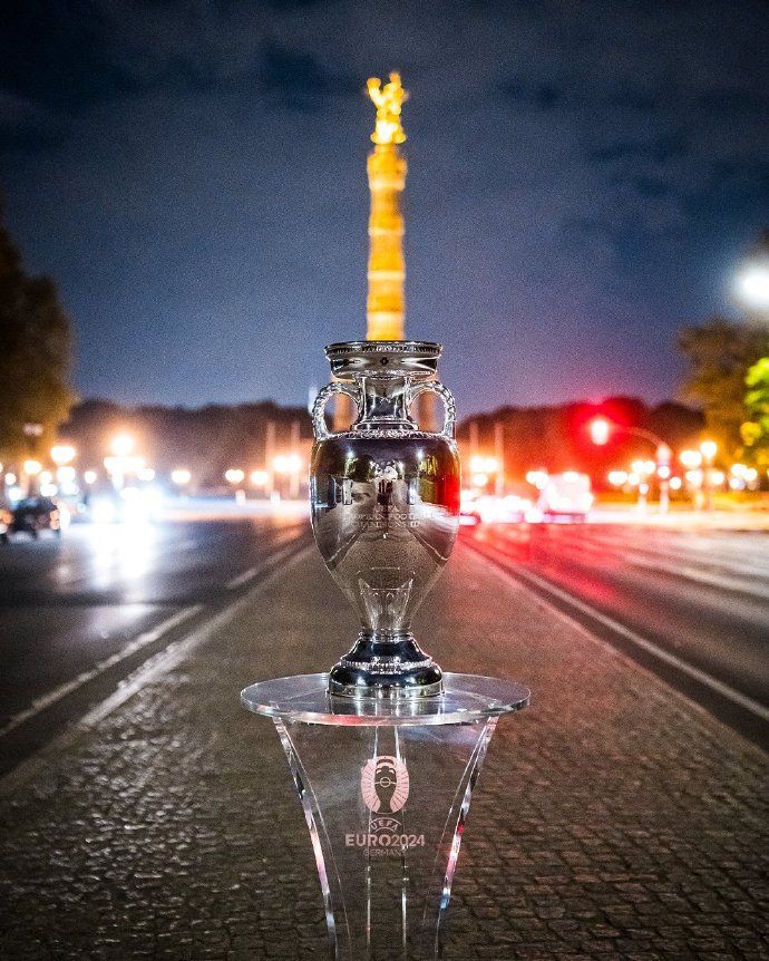 It Belongs to the Victor! The UEFA Euro Trophy Has Arrived, Posing with Berlin’s Victory Column -illustration-