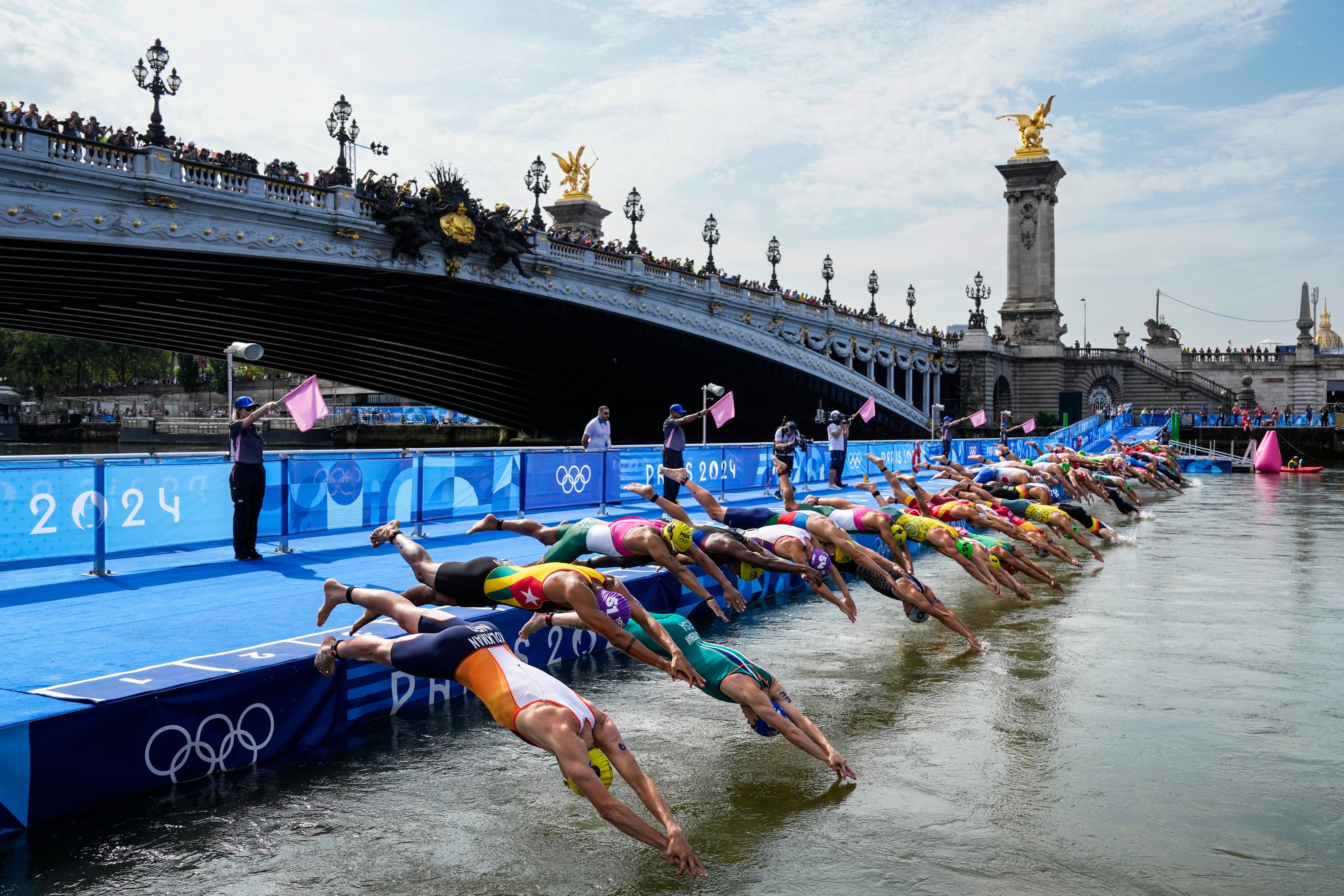 Multiple Triathletes Complain About the Poor Water Quality of the Seine River; Canadian Athlete Vomits Post-Race -illustration-