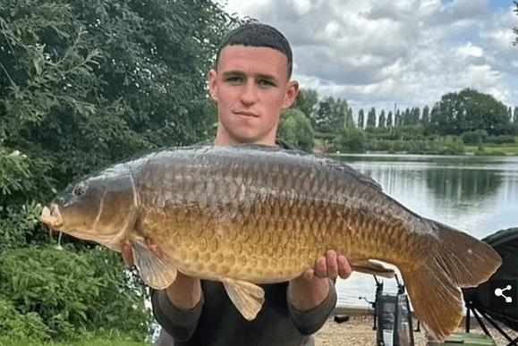 Relaxed End to Pre-Season Break! Foden Lands a Big Catch and Poses for a Picture at a £14-a-day Lake in Oxfordshire -illustration-